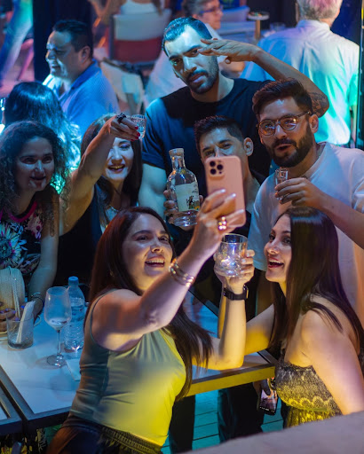 Guests enjoying drinks and capturing memories